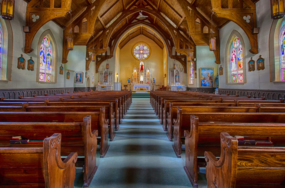 Interior of Saint Columbkille from the back showing stained glass